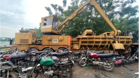 Gift Andrew/ BBC Motorcycle taxis about to be crushed