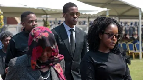 EPA Members of the Mugabe family prepare to view the body of the late Zimbabwean president on September 13 in Harare