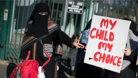 PA Parents, children and protestors demonstrate against the lessons about gay relationships, which teaches children about LGBT rights at the Anderton Park Primary School, Birmingham.