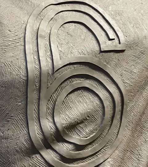 Brad Jones A teaser picture of the statue showing the number six on the back of Beattie's shirt