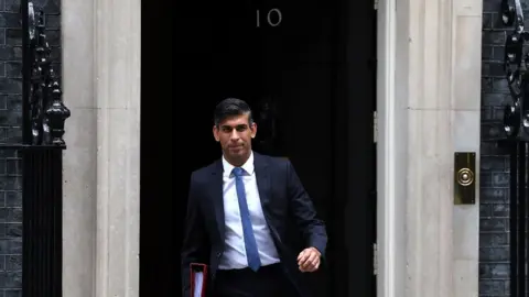 EPA Rishi Sunak walks out of 10 Downing Street