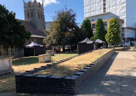 The production set near Cromwell Square in Ipswich, with the church in the background
