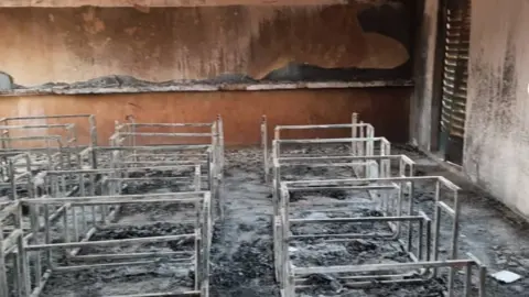 Tchima Illa Issoufou/BBC The scene at the school in Niger show remains of desks - Wednesday 14 April 2021