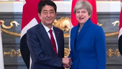 Getty Images Theresa May and Shinzo Abe