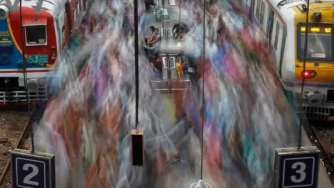 Reuters Commuters at Churchgate railway station in Mumbai in 2012