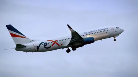 AFP Rex Airlines Boeing 737 plane flying through the air with clouds surrounding it