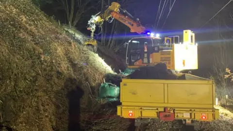 Network Rail Engineers working to repair the landslip