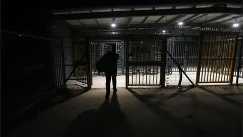 EPA Palestinian worker heading through an Israeli checkpoint in the West Bank (file photo)