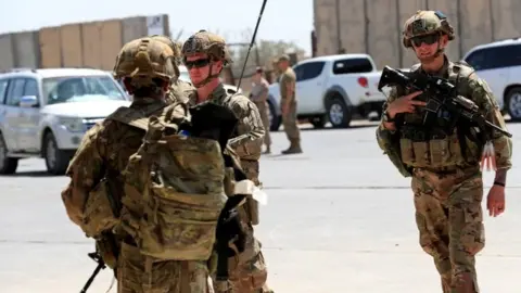 Reuters File photo showing US soldiers during a handover ceremony of Taji military base to Iraqi security forces (23 August 2020)