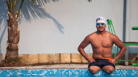 18 year old Ramesh by the poolside