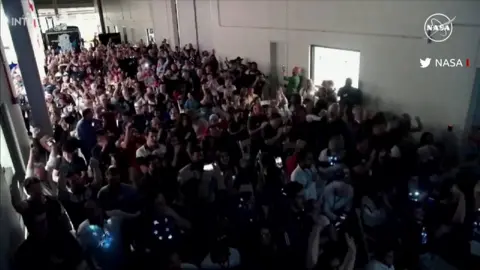 Celebrations as the moon landing was confirmed