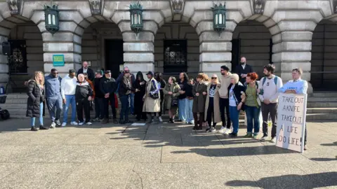 A crowd stood in Nottingham's Old Market Square