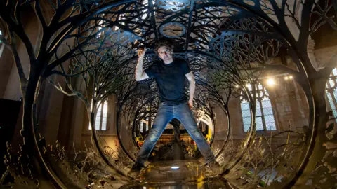 Mark Bickerdike Dan Rawlings inside his installation Future Returns