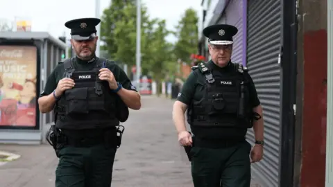 PA Media Chief Constable Simon Byrne out on patrol in north Belfast ahead of the Twelfth parades