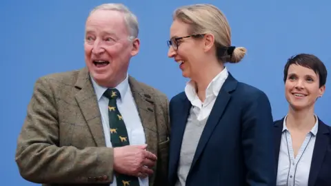 Reuters Frauke Petry (R), chairwoman of the anti-immigration party Alternative fuer Deutschland (AfD) poses next top candidates Alice Weidel and Alexander Gauland (L) before a news conference in Berlin, Germany, September 25, 2017