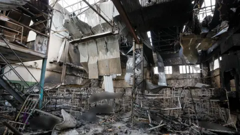 REUTERS/Alexander Ermochenko  Bodies of detainees lie among debris following the shelling at a pre-trial detention centre in the course of Ukraine-Russia conflict, in the settlement of Olenivka in the Donetsk Region, Ukraine July 29, 2022.