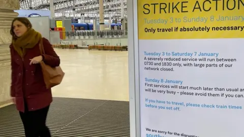 Getty Images Woman at train station