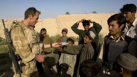 Getty Images A British soldier meets Afghans