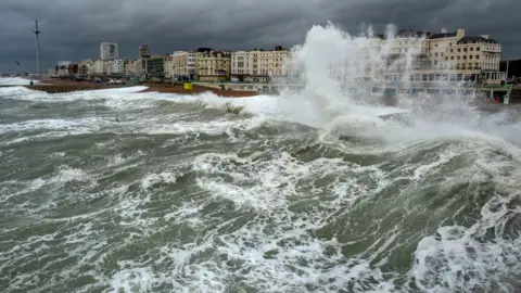 Getty Images Waves crash on the shore at Brighton beach, England. Photo: November 2018