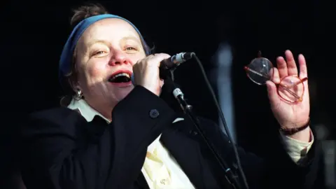 Pacemaker Mo Mowlam addressing the crowd at Elton John's concert at Stormont