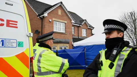 Police officers outside Nicola Sturgeon and Peter Murrell's home