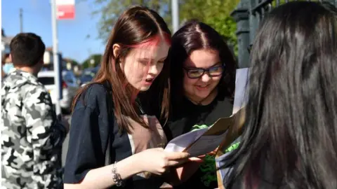 Jacob King/PA Students at Birstnall Academy, Oldbury get their GCSE grades