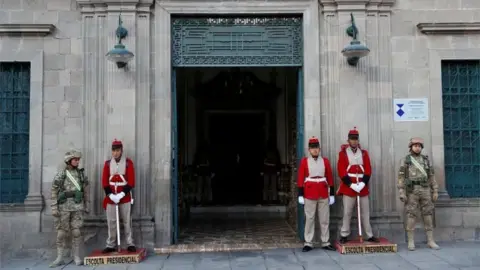 Reuters Military members stand guard at an entrance of the Presidential Palace in La Paz, Bolivia November 13, 2019.