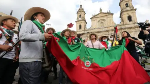 EPA Indigenous people chant in Bogotá, Colombia. Photo: 19 October 2020