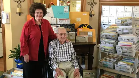 Brookdale Midwestern Joe and his daughter Beverly Cuba surrounded by his birthday cards
