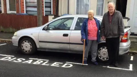 Maria and Brian Bishop by their disabled bay