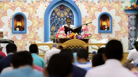 AFP A man reads from the Holy Koran in a mosque in Saudi Arabia