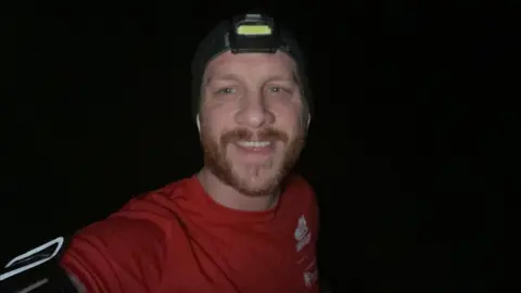 Joe Wainman Joe Wainman selfie on a run in the dark