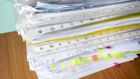 Getty Images Bundle of papers