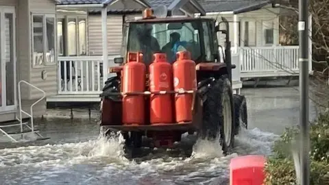 Tractor in floods at Kiln Park