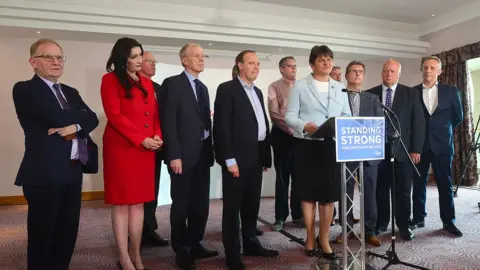 PACEMAKER Arlene Foster with Lord Morrow and her ten DUP MPs