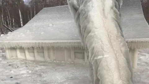 Maureen Whelan A family summer house on the shores of Lake Ontario, New York, US, has been covered in ice