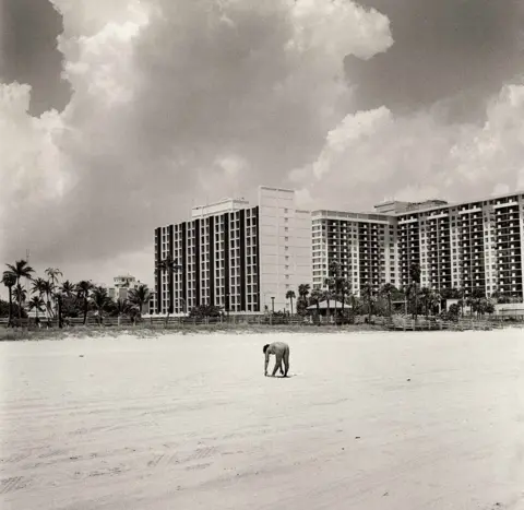 Barry Lewis A person exercises on Miami Beach