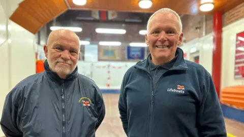 BBC Two men smile at the camera