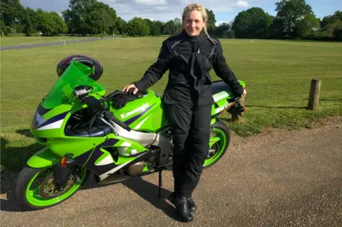 Patricia Stiemke Patricia Stiemke in front of a motorbike