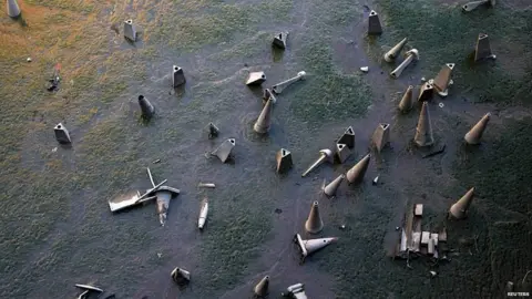 Reuters Traffic cones on the banks of the River Thames in London