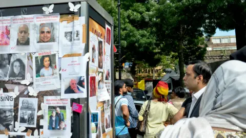 Getty Images Missing posters outside Grenfell Tower