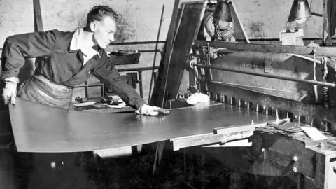 EKCO Metal worker at the ECKO factory