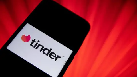 Getty Images Tinder logo on a phone