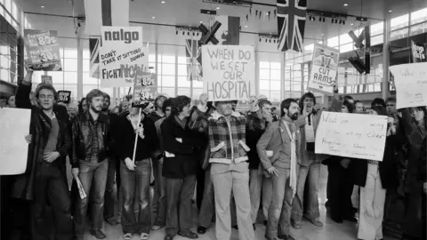 Getty Images Protesters in a Milton Keynes shopping centre awaiting Margaret Thatcher on 25 September 1979