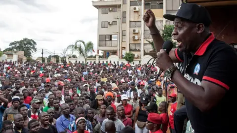 AFP Executive Director at the Centre for Human Rights and Rehabilitation Timothy Mtambo (R) addresses protesters in Lilongwe on January 16, 2020