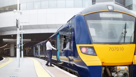 Southeastern  Man getting on board a Southeastern train