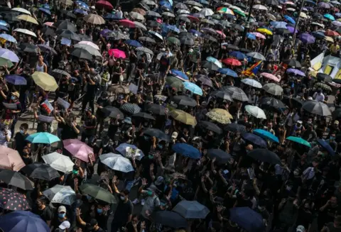 Getty Images Proesters with umbrellas in Hong Kong