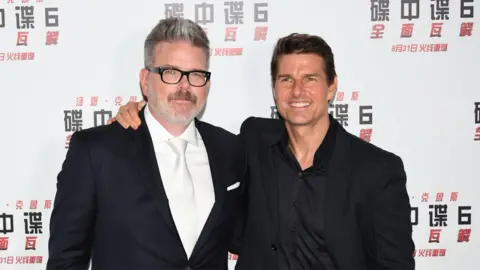 Getty Images Christopher McQuarrie (left) and Tom Cruise