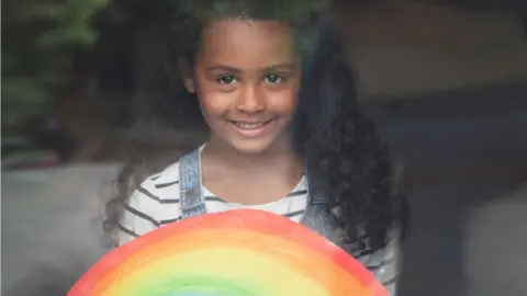 Kate Stuart Loti Ellis Lye-Scott with her NHS rainbow in Barry