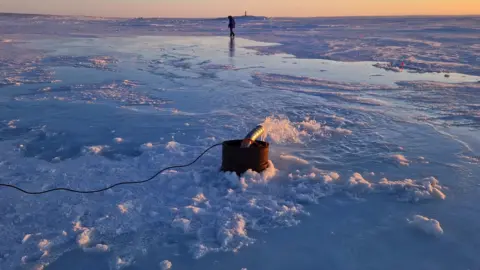 Real Ice Seawater pump in action with Arctic sunset in the background